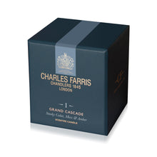 Load image into Gallery viewer, A dark blue square box for Charles Farris Grand Cascade scented candle, featuring gold lettering and a light blue-gray ribbon detail on the top, set against a clean white background.