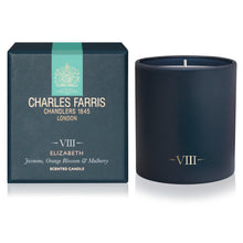 Load image into Gallery viewer, A dark navy blue scented candle in a matte cylinder container next to its matching dark teal packaging box. The box features a vertical mint green stripe and gold lettering for Charles Farris Chandler's London, with 'VIII' and the scent name 'Elizabeth' printed on the front.
