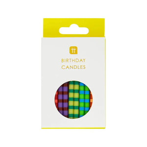Box of 24 colourful striped birthday candles by Talking Tables in assorted rainbow colours, with holders , fun and vibrant cake decorations for parties