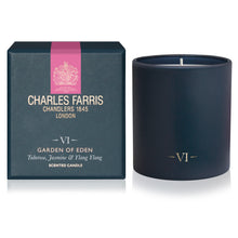 Load image into Gallery viewer, Charles Farris Garden of Eden scented candle in a matte navy blue jar next to its dark teal packaging box with a pink stripe and gold lettering.
