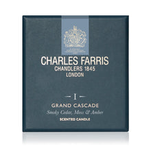 Load image into Gallery viewer, Charles Farris Grand Cascade scented candle packaging box, featuring a dark slate blue textured cover with cream lettering and a light blue crest banner at the top, set against a plain white background.
