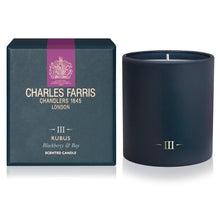 Load image into Gallery viewer, A Charles Farris Rubus scented candle in a matte navy blue vessel next to its dark teal packaging box with gold lettering and a purple accent band.
