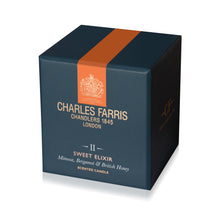 Load image into Gallery viewer, Charles Farris scented candle box with an orange stripe on a white background
