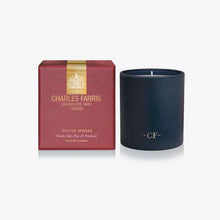 Load image into Gallery viewer, A Charles Farris scented candle in a matte navy blue glass jar next to its textured burgundy packaging box with gold lettering and a gold crown emblem.
